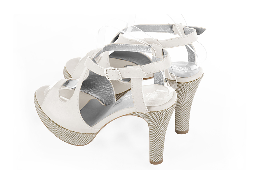Pure white women's open back sandals, with crossed straps. Round toe. Very high slim heel with a platform at the front. Rear view - Florence KOOIJMAN